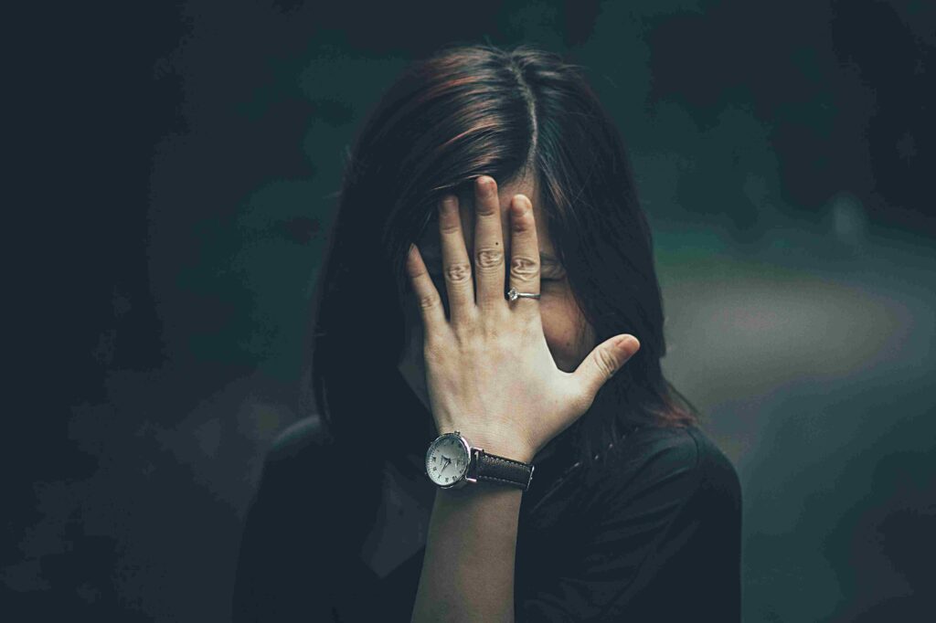 A woman wearing a leather watch