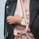 A women sporting a gold coloured watch