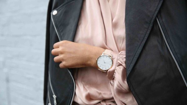 A women sporting a gold coloured watch