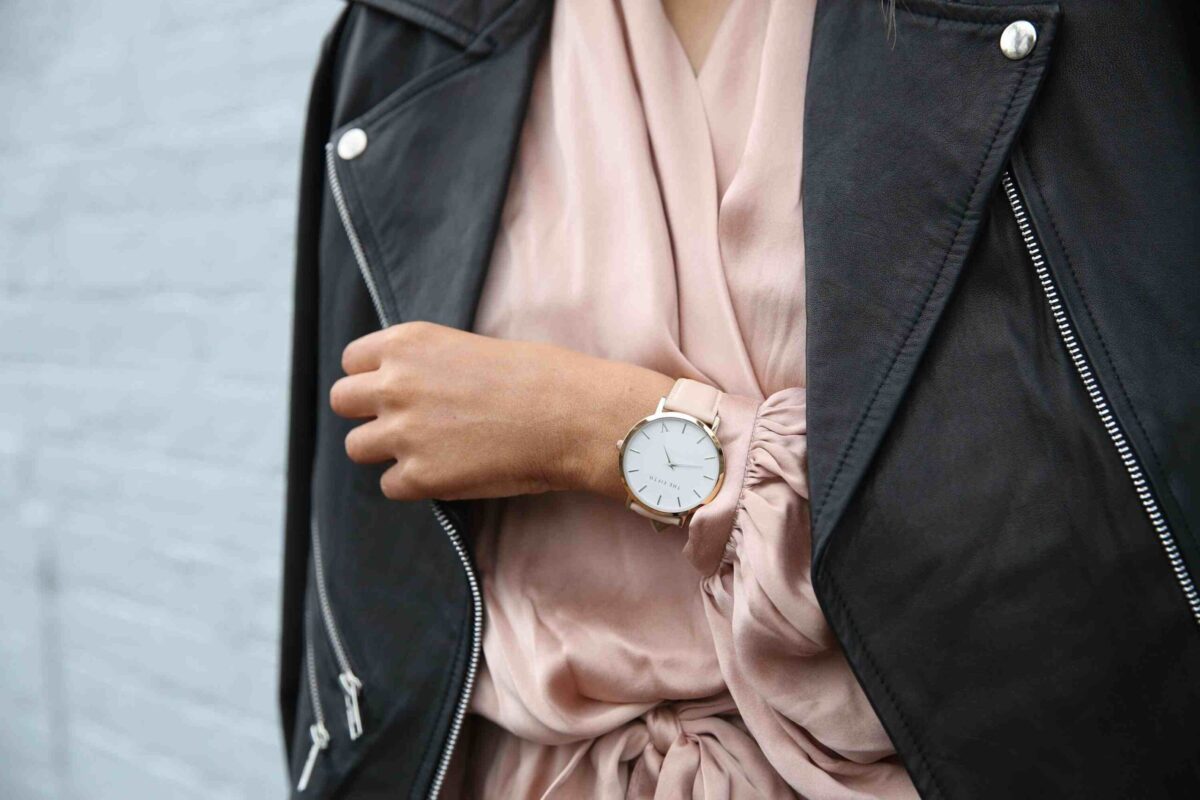 A women sporting a gold coloured watch