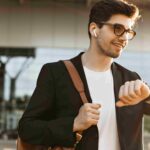 A man casually looking at his watch