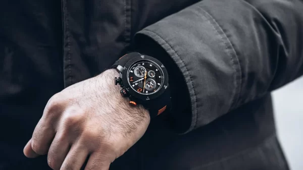 A man wearing a black watch