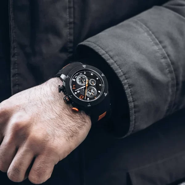 A man wearing a black watch