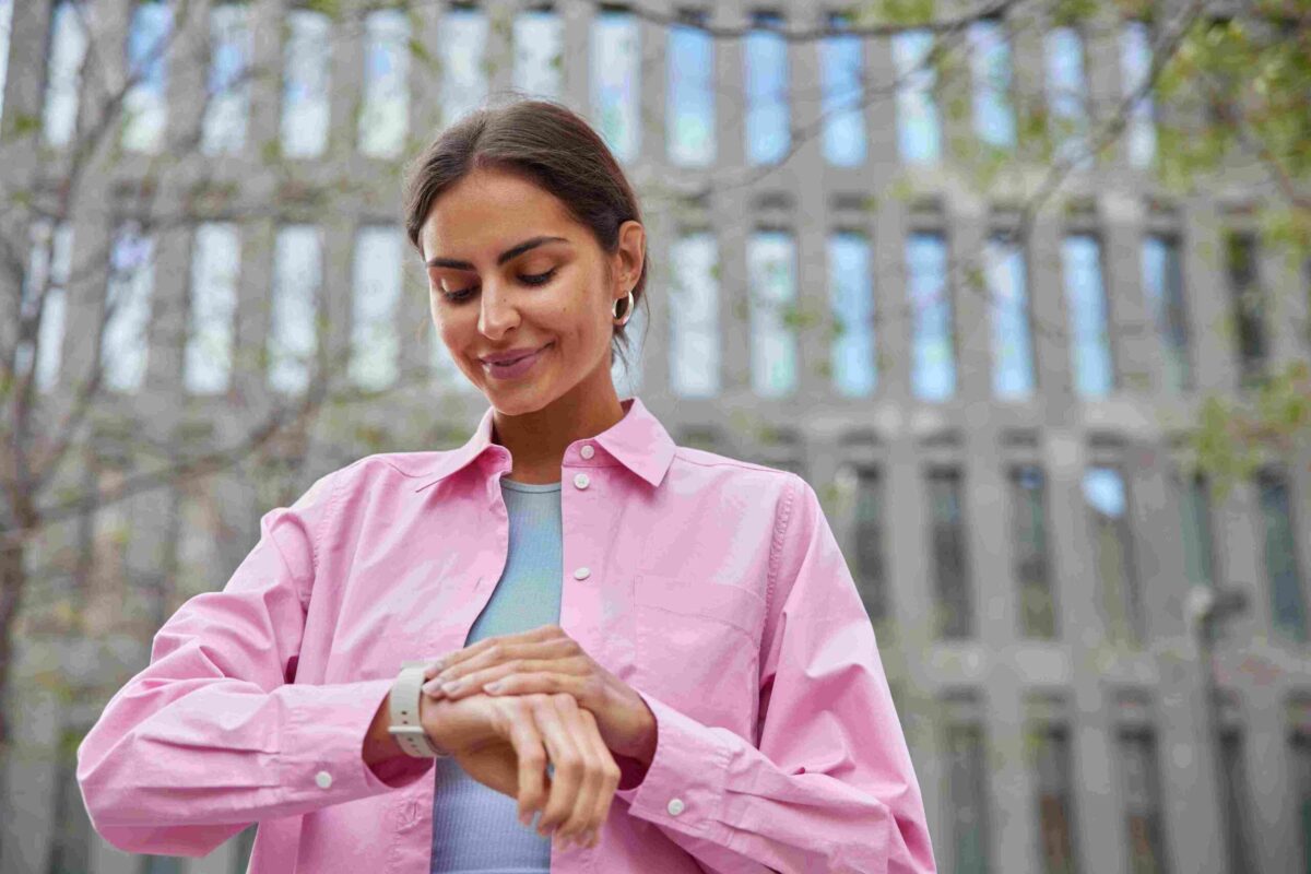 Woman looking at her watch