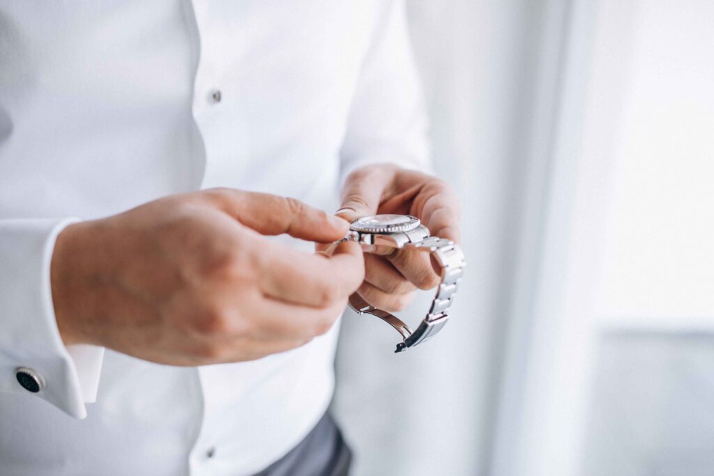 A man carefully checking his watch