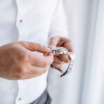 A man carefully checking his watch